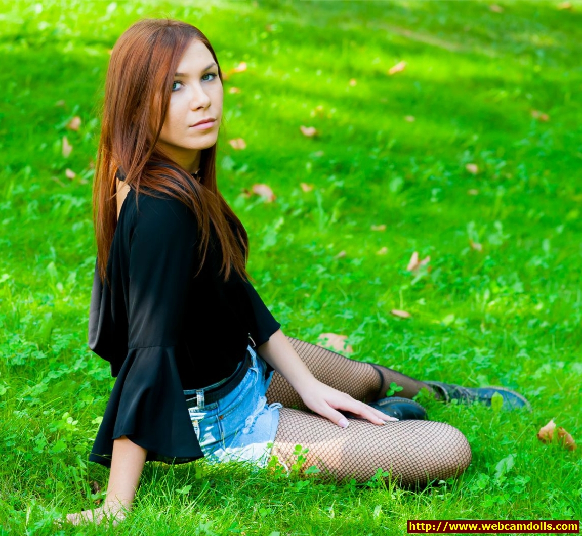 Redhead Girl in Black Fishnet Pantyhose and Black Shirt on Webcamdolls